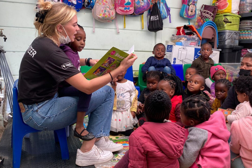 SAVE Foundation supporter reading to children