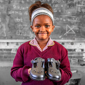 giving back-schoolshoes